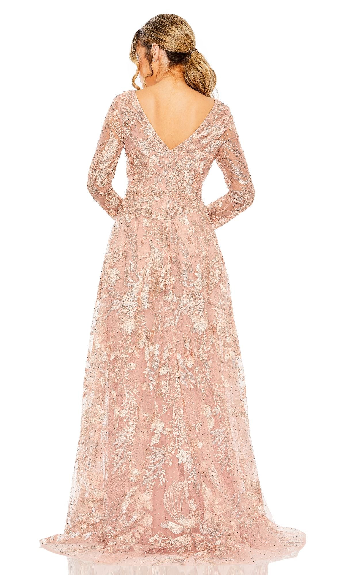 Woman in a Mac Duggal 20214: long sleeve, blush pink lace formal dress with floral embroidery and V-back neckline, shown from the back.